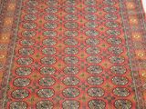 a red rug with medallions and medallions on a white background