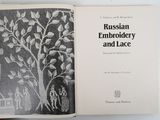 an open book with a picture of a man and a tree