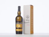 a close up of a bottle of wine next to a box