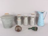 many different types of tins and containers on the table