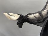 an image of a mannequin wearing a black dress with a black bow