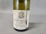 a bottle of wine that is sitting on a table