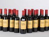 six bouteilles de vin rouge alignées sur une table