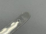 a knife that is laying on a table