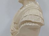 marble bust of a young man with a ruffled collar
