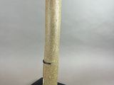 an image of a sculpture of a cylinder on a black base