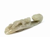 jade carved figurine of a man with a fish on his back