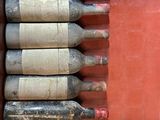 six bottles of wine sitting in a red box