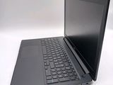 a laptop computer sitting on top of a white table