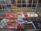 a metal cage with food inside of it in a store