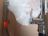 a water faucet that is in a box
