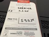 a parking ticket on the front of a car