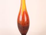 a vase that is sitting on a white surface