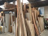 several pieces of wood are stacked on top of each other in a warehouse