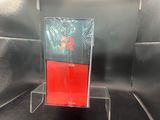 a picture of a display case with a red flower on it