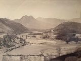 a black and white photo of a bridge over a river