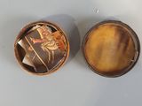 a small box that has a picture of a woman on it