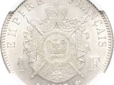 a close up of a silver coin with a crown on it