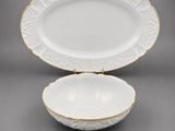 a white and gold plate with a gold rim and gold trim