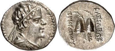 a silver coin with a head of a man on it