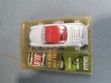 a toy car that is in a box on a table