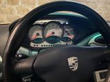 steering wheel of a car with gauges, gauges, and gauges