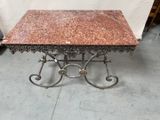 a table with a marble top on it in a room