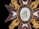 an image of a gold and purple star with a monogram on it