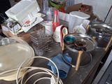 many pots and pans sitting on a table