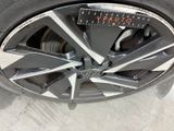 a close up of a car tire with a calculator on it