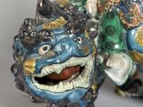 a figurine of a dragon with a man on it