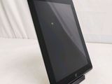 a tablet that is sitting on a stand on the table