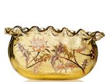 un saladier en verre jaune orné d'un motif floral
