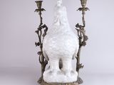 an image of a statue of a woman sitting on top of a white elephant