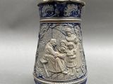 an image of a blue and white vase with a scene on it