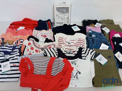 a lot of clothes that are sitting on a table