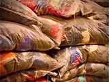 many bags of sand sitting on top of each other