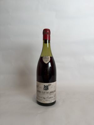 a bottle of wine that is sitting on a table
