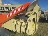 a close up of a yellow crane with a red and white stripe on it