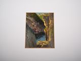 a painting hanging on the wall above a bed