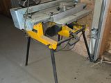 a picture of a table saw in a garage