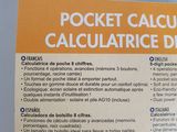 packaging of a pocket calculator with a calculator on top of it