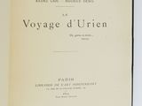 an open book on a white surface with a black border