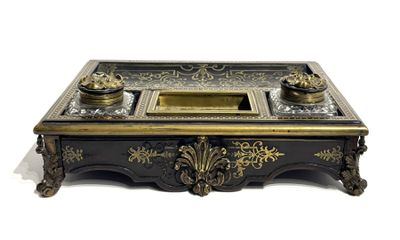 a black and gold desk with a glass top