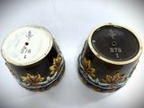 two vases with numbers on them sitting on a table