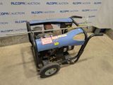 an image of a small air compressor in a garage