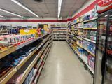 many shelves in the store that are stocked with various items