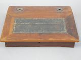 an old wooden box with a black label on it