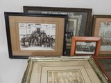 many framed pictures of men and women on the wall