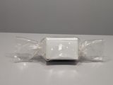 a white candy wrapped in plastic on a table